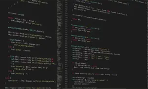 Fragment kodu PHP z komentarzem: `// To jest komentarz w PHP`. Widać pętle `foreach` i `array_multisort`.